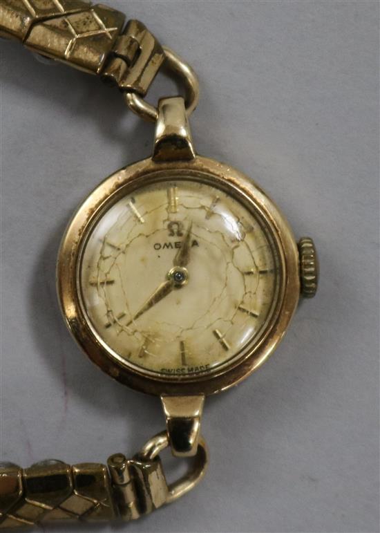 A ladys 9ct gold Omega manual wind wrist watch.